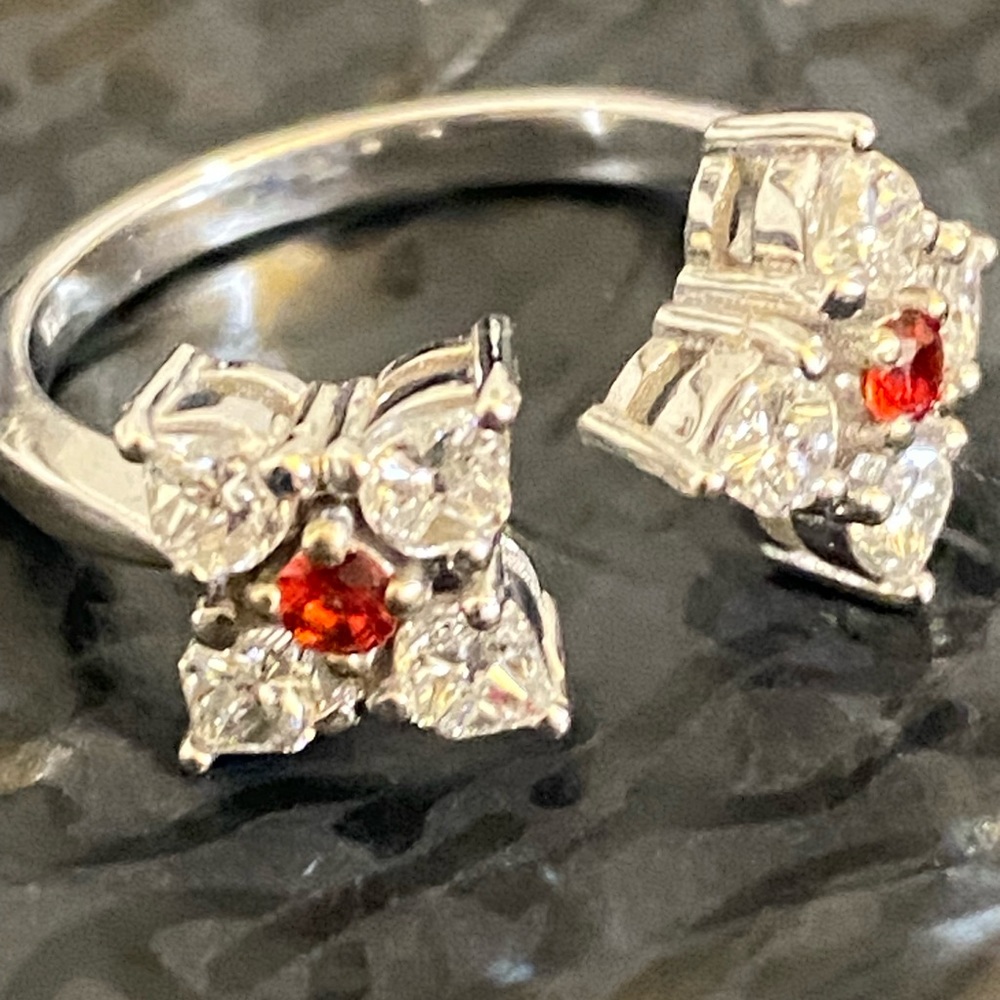 Stunning Diamond and Orange Sapphire “Et Moi” ring set in 18k gold.
